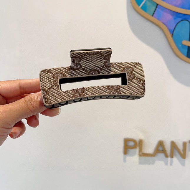 CLAW CLIP IN BEIGE AND EBONY MONOGRAM CANVAS AND RESIN 310623