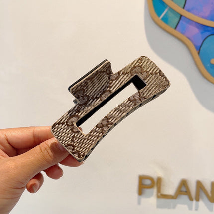 CLAW CLIP IN BEIGE AND EBONY MONOGRAM CANVAS AND RESIN 310623