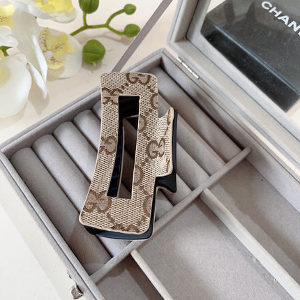 CLAW CLIP IN BEIGE AND EBONY MONOGRAM CANVAS AND RESIN 310623