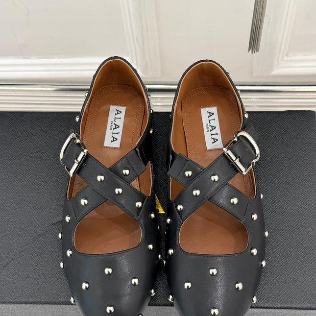 CROSSED STRAP BALLET FLATS IN BLACK CALFSKIN