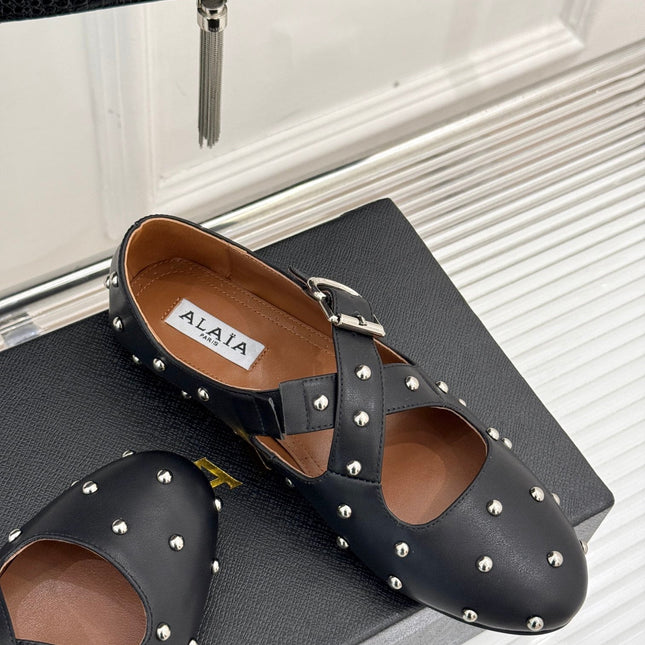 CROSSED STRAP BALLET FLATS IN BLACK CALFSKIN