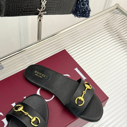 SLIDE SANDALS IN BLACK CALFSKIN WITH GOLD HARDWARE