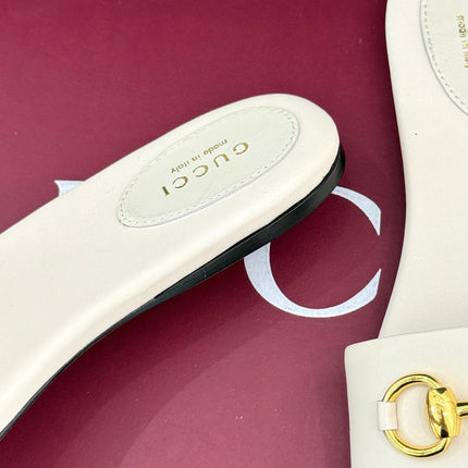 SLIDE SANDALS IN WHITE CALFSKIN WITH GOLD HARDWARE