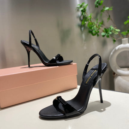 TWO STRAP HIGH HEELED SANDALS IN BLACK GLOSSY SHEEPSKIN