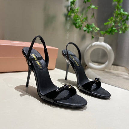 TWO STRAP HIGH HEELED SANDALS IN BLACK GLOSSY SHEEPSKIN