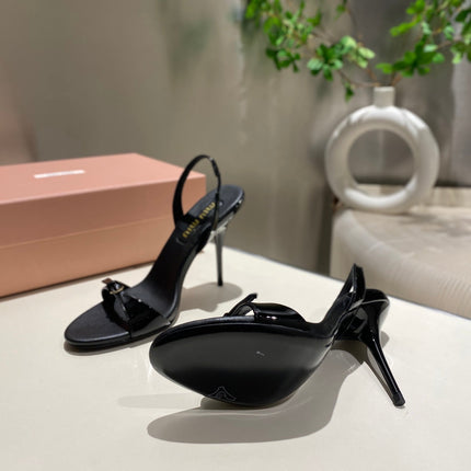 TWO STRAP HIGH HEELED SANDALS IN BLACK GLOSSY SHEEPSKIN