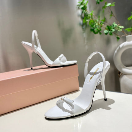 TWO STRAP HIGH HEELED SANDALS IN WHITE GLOSSY SHEEPSKIN