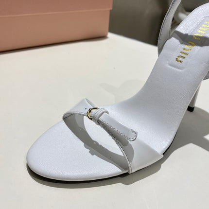 TWO STRAP HIGH HEELED SANDALS IN WHITE GLOSSY SHEEPSKIN