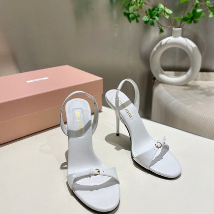 TWO STRAP HIGH HEELED SANDALS IN WHITE GLOSSY SHEEPSKIN