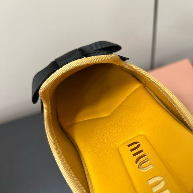 BOW MULES IN DUST YELLOW SUEDE