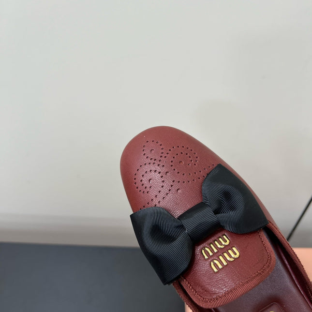 BOW MULES IN RED BROWN SHEEPSKIN