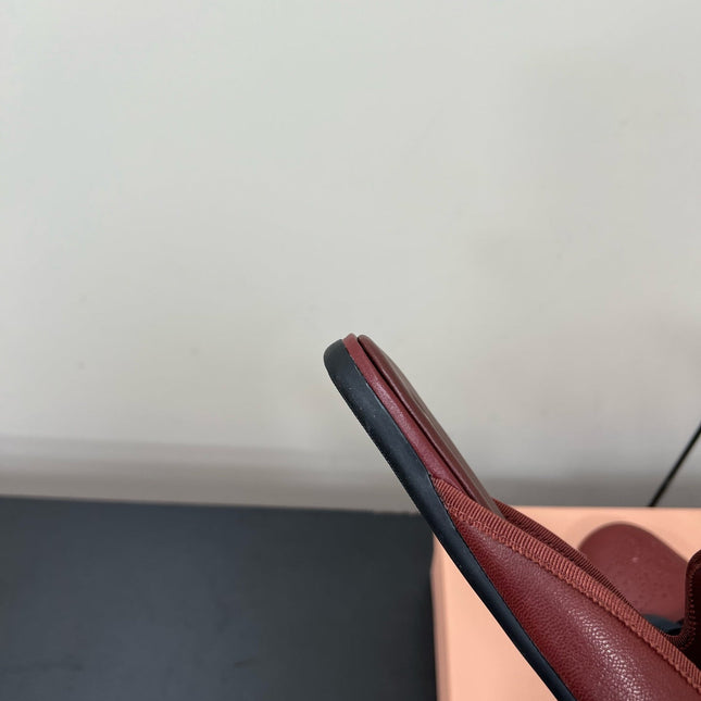 BOW MULES IN RED BROWN SHEEPSKIN