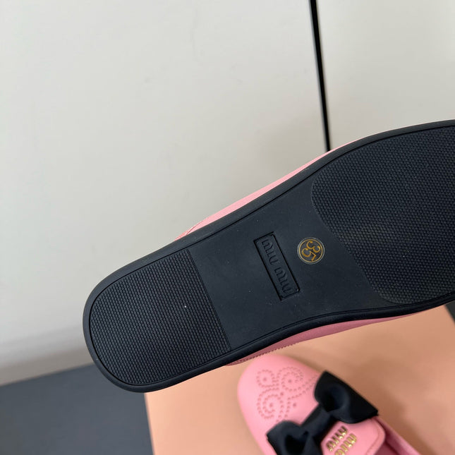 BOW MULES IN PINK SHEEPSKIN