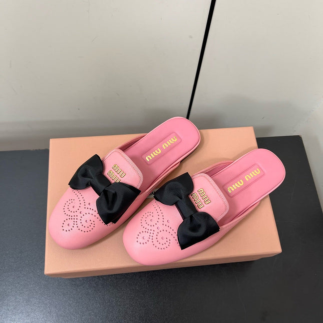 BOW MULES IN PINK SHEEPSKIN