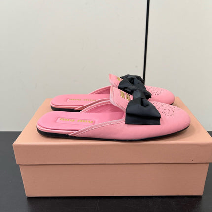 BOW MULES IN PINK SHEEPSKIN