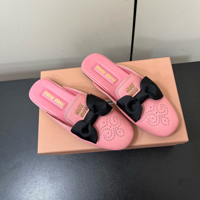 BOW MULES IN PINK SHEEPSKIN