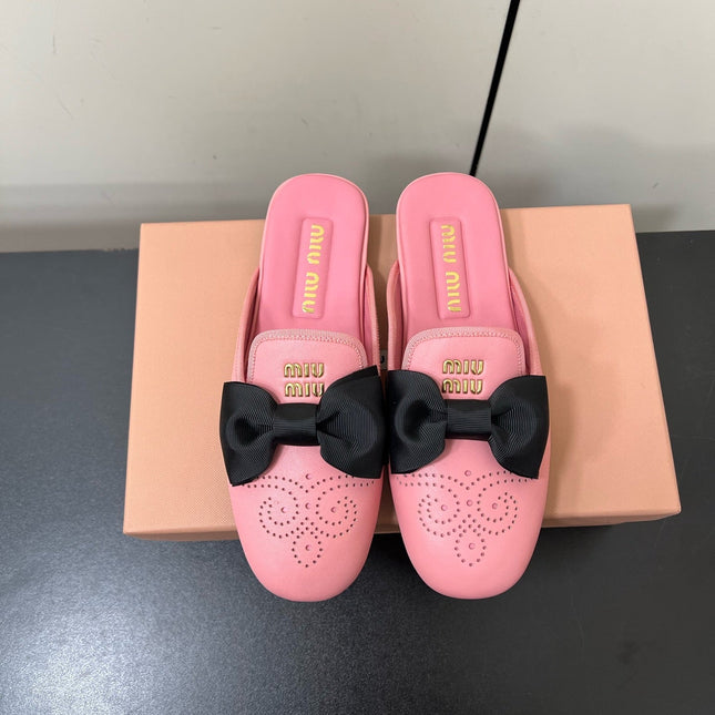 BOW MULES IN PINK SHEEPSKIN