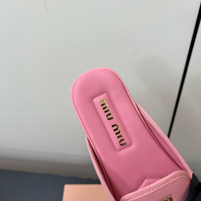 BOW MULES IN PINK SHEEPSKIN