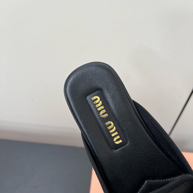 BOW MULES IN BLACK SHEEPSKIN