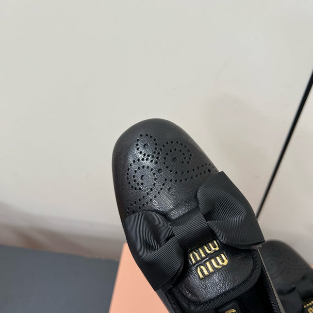 LOAFERS WITH BOW IN BLACK SHEEPSKIN