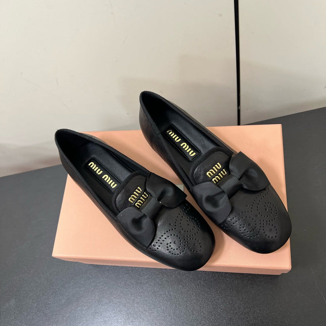 LOAFERS WITH BOW IN BLACK SHEEPSKIN