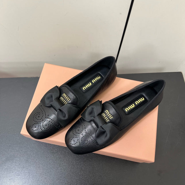 LOAFERS WITH BOW IN BLACK SHEEPSKIN