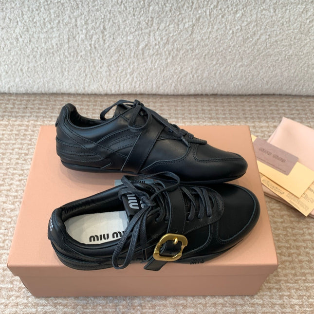 GYMNASIUM SNEAKER IN BLACK CALFSKIN WITH GOLD BUCKLED STRAP