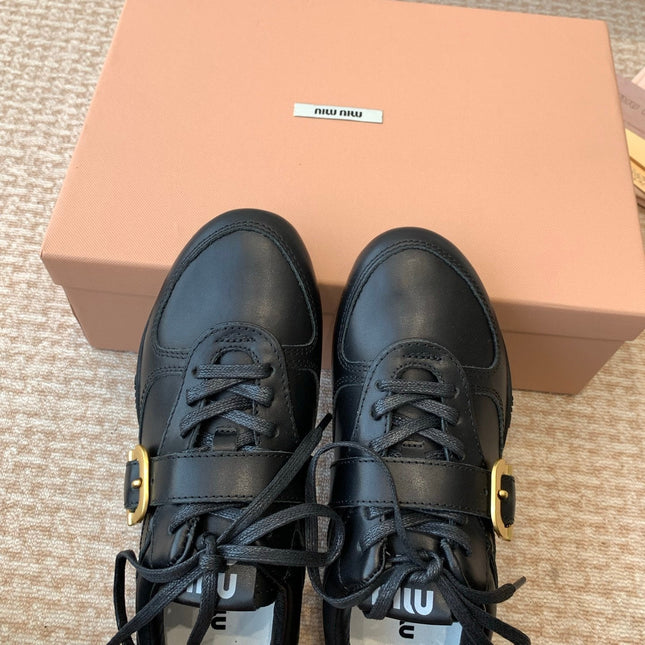 GYMNASIUM SNEAKER IN BLACK CALFSKIN WITH GOLD BUCKLED STRAP