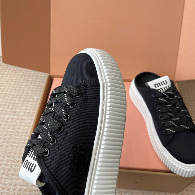 WASH SNEAKER MULES IN BLACK DENIM