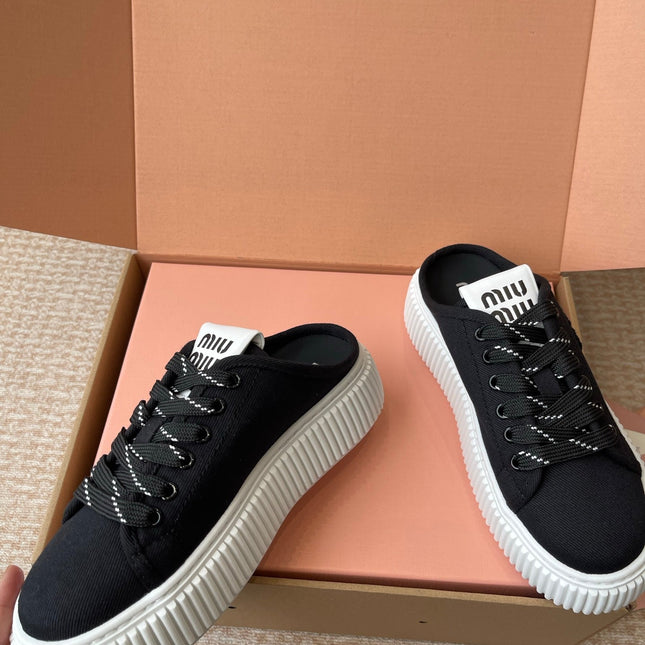 WASH SNEAKER MULES IN BLACK DENIM