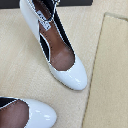 DECOLLETE PUMPS IN WHITE PATENT CALFSKIN