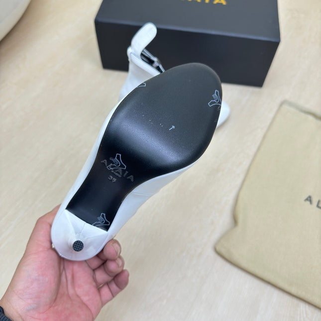 DECOLLETE PUMPS IN WHITE PATENT CALFSKIN