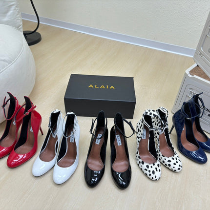 DECOLLETE PUMPS IN WHITE PATENT CALFSKIN