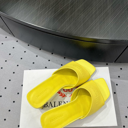 SQUARE-TOE MEDIUM HEEL MULES IN YELLOW CALFSKIN LOGO EMBOSSED