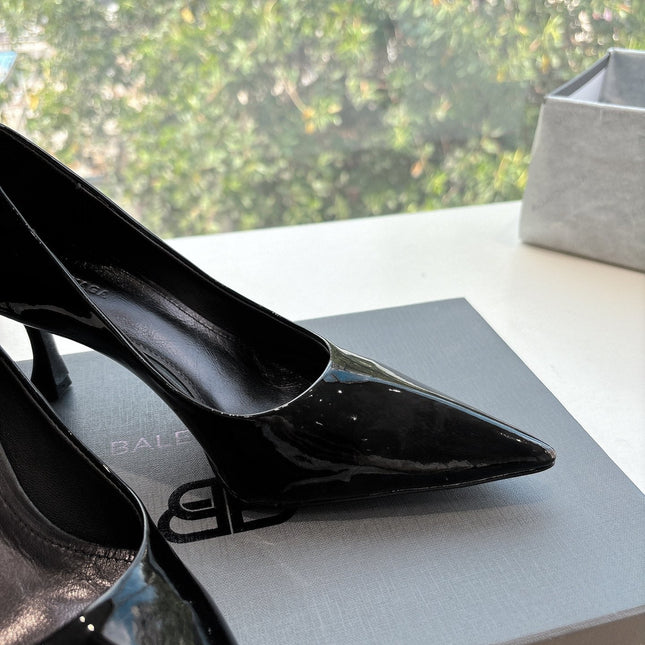 HIGH PUMPS IN BLACK PATENT CALFSKIN