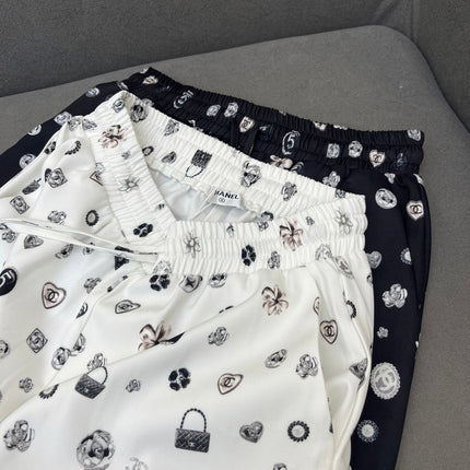 ALL-OVER LOGO PRINTED PANTS WITH STRETCH WAIST