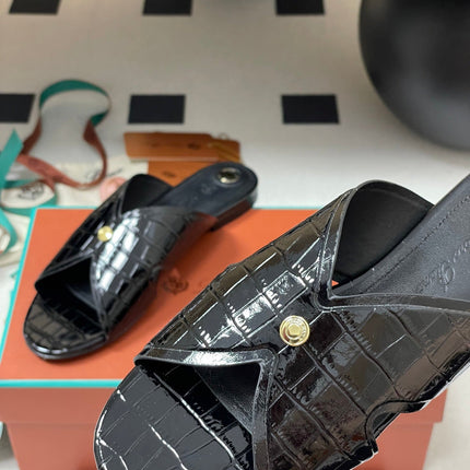 FLAT SLIPPERS IN BLACK CALFSKIN SNAKE EMBOSSING