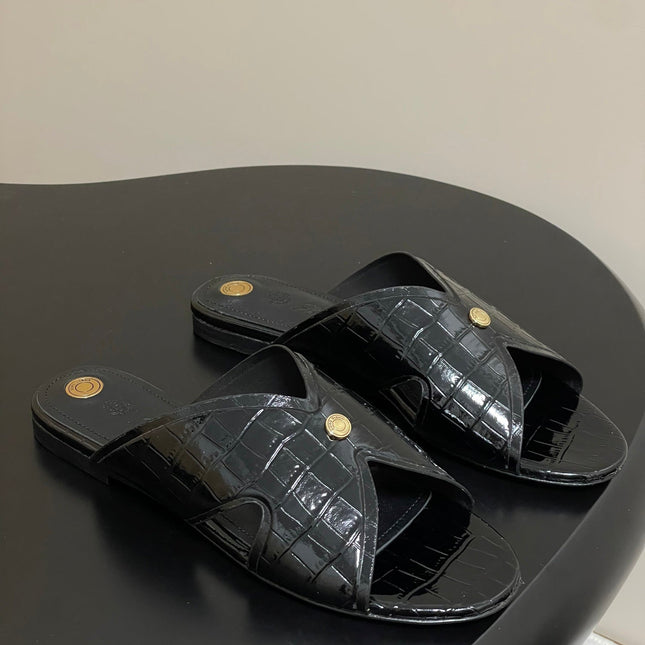 FLAT SLIPPERS IN BLACK CALFSKIN SNAKE EMBOSSING