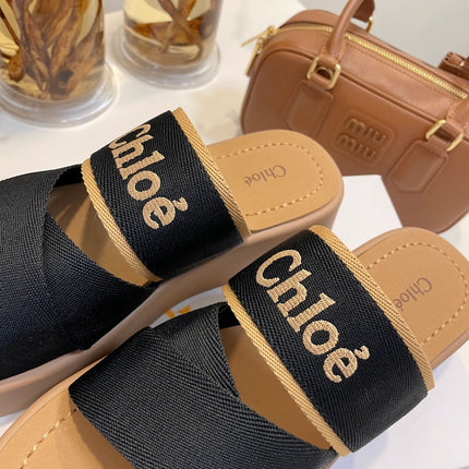 CHLOÉ WOODY WEDGE SANDALS IN BLACK CANVAS WITH CIDER BROWN RUBBER SOLE