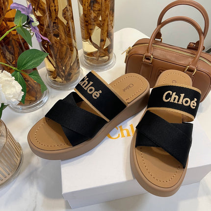 CHLOÉ WOODY WEDGE SANDALS IN BLACK CANVAS WITH CIDER BROWN RUBBER SOLE