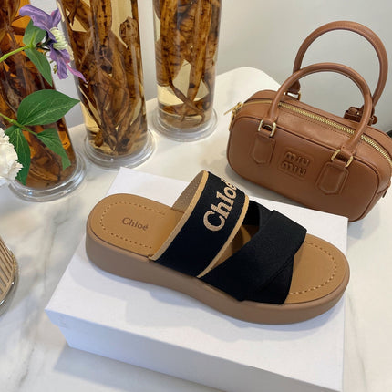 CHLOÉ WOODY WEDGE SANDALS IN BLACK CANVAS WITH CIDER BROWN RUBBER SOLE