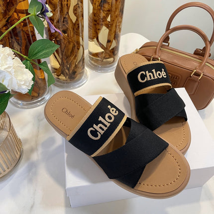 CHLOÉ WOODY WEDGE SANDALS IN BLACK CANVAS WITH CIDER BROWN RUBBER SOLE