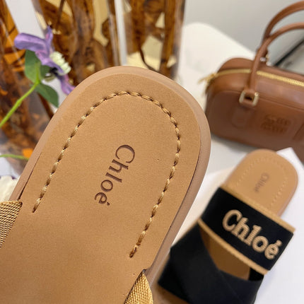 CHLOÉ WOODY WEDGE SANDALS IN BLACK CANVAS WITH CIDER BROWN RUBBER SOLE