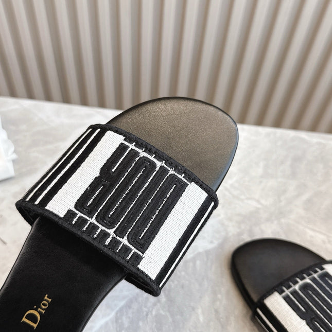 DIOR FLAT SLIDES 25S IN BLACK CALFSKIN AND FABRIC BRAND NAME EMBROIDERY
