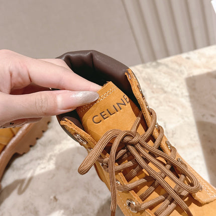 CELINE 25S MARTIN BOOTS IN MEDIUM ORANGE CALFSKIN