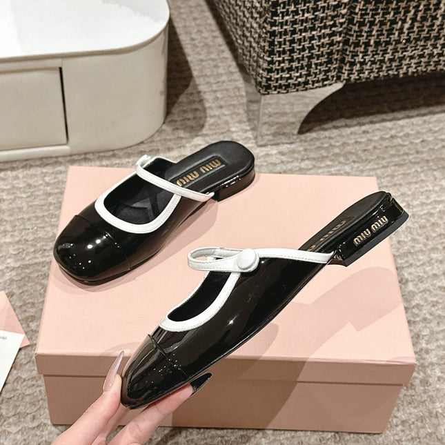 FLAT MULE IN BLACK AND WHITE PATENT CALFSKIN