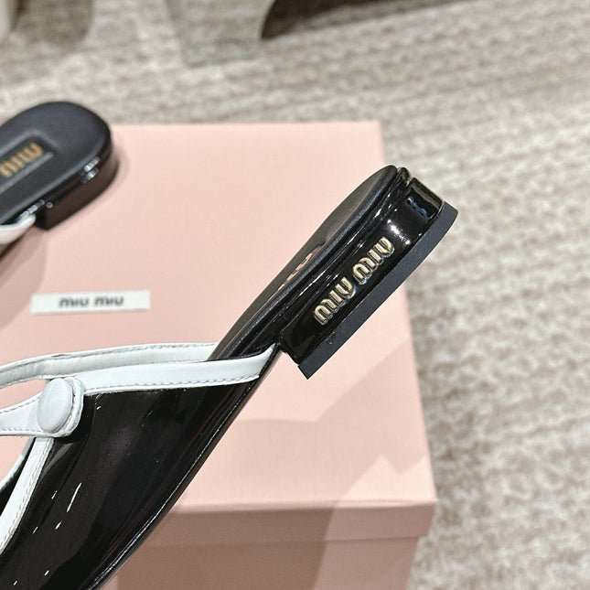 FLAT MULE IN BLACK AND WHITE PATENT CALFSKIN