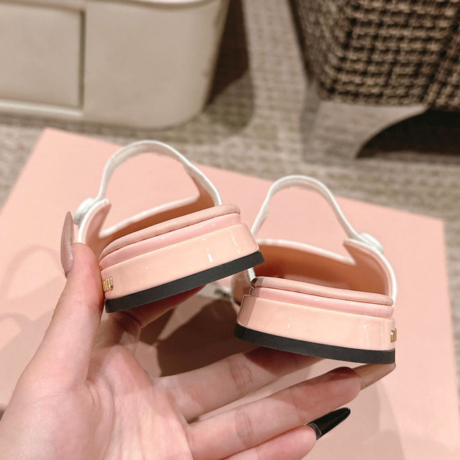 FLAT MULE IN PALE PINK PATENT CALFSKIN