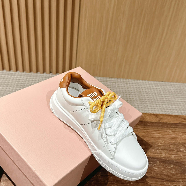 MM SNEAKERS IN WHITE CALFSKIN WITH YELLOW LACES