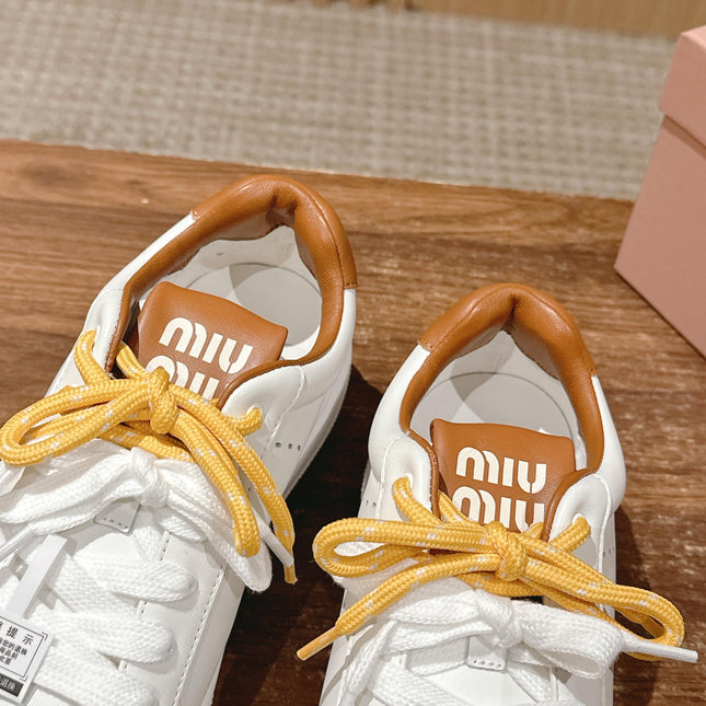 MM SNEAKERS IN WHITE CALFSKIN WITH YELLOW LACES